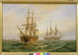 Deux navires passant au coucher du soleil